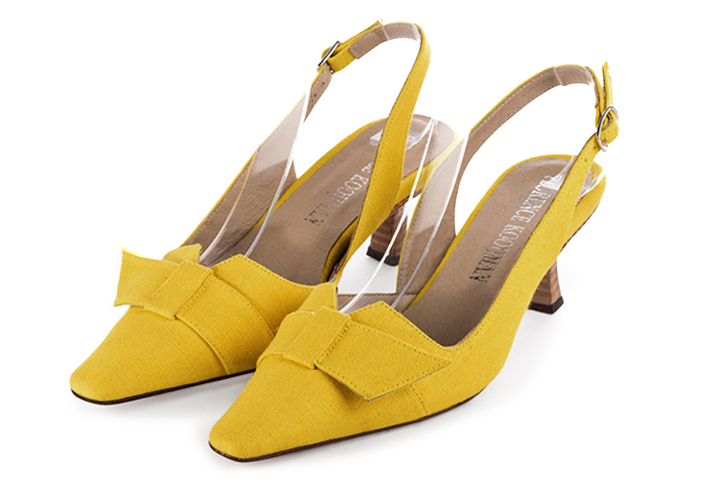 Yellow women's open back shoes, with a knot. Tapered toe. Medium spool heels. Front view - Florence KOOIJMAN